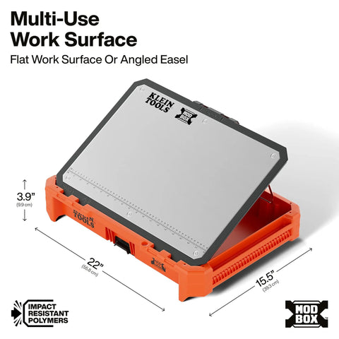Side view of a MODbox Tray Work Top Grab And Go Portable Work Surface showcasing the stainless steel modular surface on an orange base.