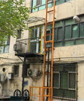 Heavy Duty Mobile Lift Platform Equipped With Guide Rail Vertical Elevator Mechanism Built From Thickened Steel For Buttery Smooth One Person Cargo Loading And Site Hauls near building with balcony.