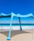 Pop Up Beach Tent Sun Shelter Grande 10x10ft Canopy With 4 Stability Poles, Easy Carry Bag, outdoor shade setup on a sunny beach