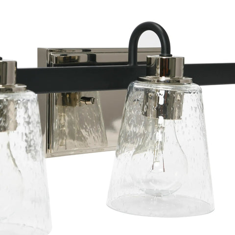 Three Light Vanity Fixture With Seeded Glass Diffusers Matte Black Finish With Polished Nickel Accents close-up