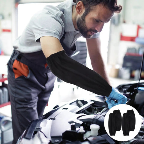 Premium Two Pack Waterproof Polyurethane Arm Sleeves Feel Built Like A Tank With Full Forearm Grease Guard Coverage That Simply Wipes Clean After Hectic Kitchen Or Auto Shop Grinds worn by a mechanic.