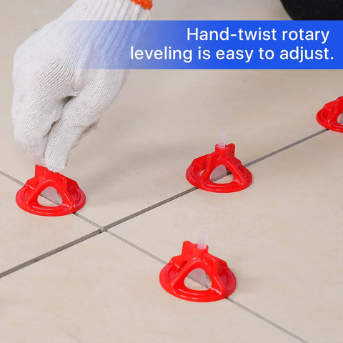 Hand adjusting Hardcore 1/16 Inch Tile Leveling Clips And Spacer Set With 2000 White Base Plates for precise tile leveling.