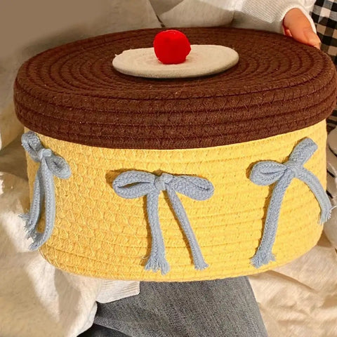 Legit Handwoven Cotton Storage Basket With Snug Dustproof Lid Solid Home Hub Organizer Perfect For Bedroom Clothes And Living Room Gear Nifty Space Saving Set Up You Will Score, yellow basket with blue bows and brown lid.