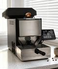 Legit Automatic Electric Coffee Bean Roaster For Home Kitchens packed with advanced features on a countertop with coffee cup.