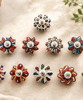 Set Of Ten Totally Rad Vintage Ceramic Drawer Pulls And Cupboard Cabinet Door Knobs Featuring Super Sleek Multicolor Designs Plus Rock Solid Chrome Hardware on a surface.