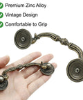 8 Pack 3.5 Inch Center Pull Cabinet Handles Antique Bronze Dresser Knobs With A Classic Retro Look Hella Durable Heavy Duty Drawer Hardware For Kitchen Cupboards And Home Upgrades Slick Feel And Quick Grip Installation in hand showing curved design