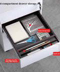 Open drawer of Compact Metal Rolling File Cabinet With Lock For Home Office, 3-Drawer Under-Desk Storage with stationery items.