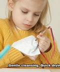 Eyeglass lens wipes with pink-wrapped packaging and a white microfiber cloth