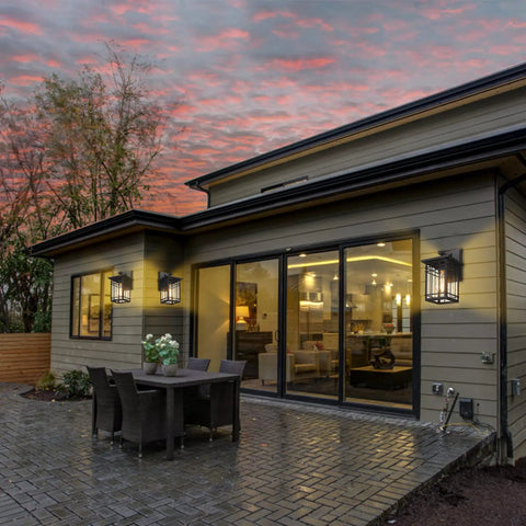 Modern home with Dusk To Dawn Exterior Wall Lights With Built In Sensor, illuminating backyard with outdoor seating area.