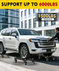 Heavy Duty Car Dolly Set Of Four Rock Solid 6000 Lbs Wheel Dollies With Parallel Tube Grip in use with an SUV on smooth pavement.