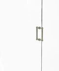 8 Inch Back To Back Shower Door Pull With Twisted Accent In Polished Nickel installed on glass