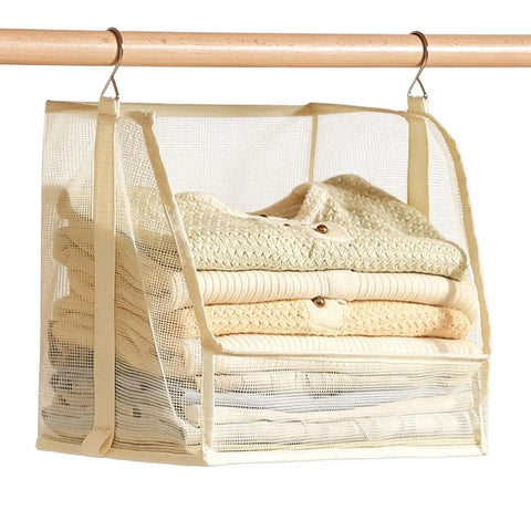 Premium Hanging Closet Organizer With Ultra Soft Fabric Shelves storing folded sweaters and towels in cream mesh design.