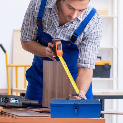 Blue Iron Toolbox With Heavy Duty Lock And Steel Reinforced Corners Comfortable Grip Bar For Hardware Bits Sorting on a workbench.