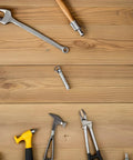 Heavy Duty Stainless Steel Folding Fan Rivet Nut Repair Kit Featuring Five Sets Of Tight Grip Shaft Fasteners For Smooth Cruising Motion And No Sweat Handheld Fan Revamp with tools on wooden surface.