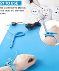 Easy setup of anti static mat for electronics workbench with wrist strap and grounding cord for safe electronics handling.