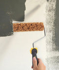 Pineapple Texture Sponge Paint Roller for Walls painting a textured pattern on a light wall, showcasing its sponge grip and geometric design.