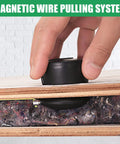 Close-up of a hand using Magnetic Wire Puller Tool for Electrical Installations and Cable Runs No Sweat Fish Tape Wire Pulling System