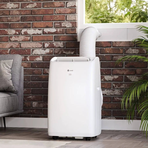 Portable air conditioner with 5.9 inch exhaust hose using Adjustable Window Vent Kit For Portable Air Conditioners in brick-walled living room