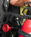 Close-up of Mounting Bracket Base For MOLLE Panels 2 Pack Ready To Roll Universal Adapter installed with fire extinguisher.