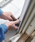 Person installing Heavy Duty Sliding Screen Door Pulley Wheel Replacement Rollers for smooth operation.