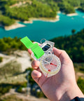 Portable Hiking Compass Thumb Orienteering Tool with precision acrylic construction in hand outdoors.