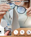 Eyeglass lens cleaning wipes, individually wrapped, with six microfiber cloths; person wiping glasses.