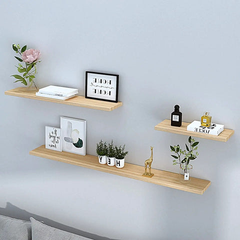 Built Like A Tank Hidden Floating Shelf Brackets 2 Or 4 Pack installed with wooden shelves and decorative items on a wall.