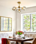 Dining room with Amber Glass Bubble Sputnik Chandelier In Brass Gold Finish, 3 Light Semi Flush Mount Ceiling Light