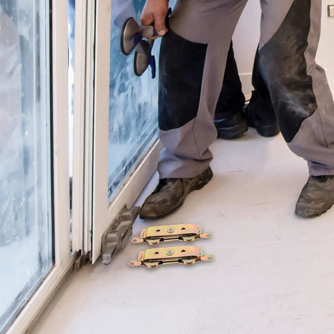 Worker installing Heavy Duty Aluminum Alloy Sliding Door Rollers Featuring Double Bearing Wheels For Slick Patio Track Replacement.