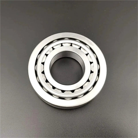 Badass Stainless Steel Tapered Roller Bearings S32014 70mm By 110mm By 25mm showing detailed inner structure on a dark background.