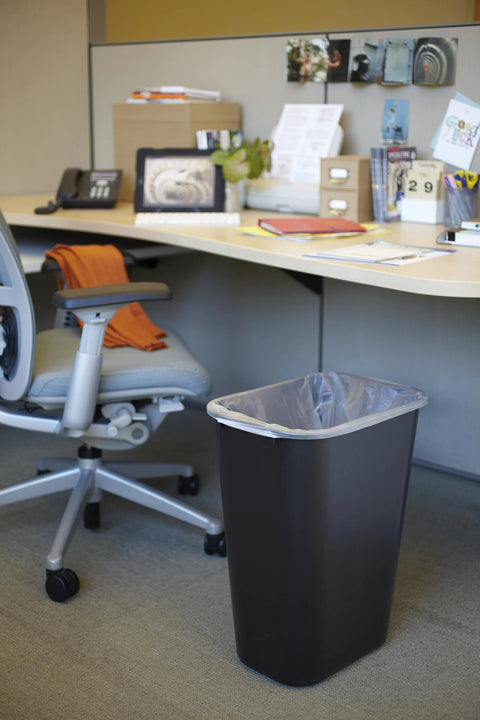 Durable 41 Quart Stackable Wastebasket Trash Can In Black, Heavy Duty Plastic With Rolled Rim For Easy Cleaning next to desk