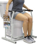 Heavy Duty Toilet Safety Rail With Arms Providing Top Shelf Bathroom Support, designed for senior mobility, shown in use next to toilet.