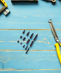 Hex Spacer Standoff Nut Kit Nylon Black For PC Case And Hard Drive Mounts With Precise Assortment To Minimize Vibration And Noise Boost Mount Stability And Protect Circuitry In Your Daily Tech Builds. Black nylon hex spacers, screws and nuts on blue surface