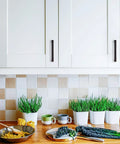 Kitchen cabinets with 30 Pack Solid 3-1/2 Inch Square Cabinet Handles in Oil Rubbed Bronze installed