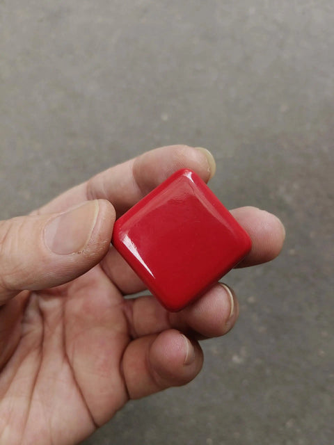 Totally Fresh Glossy Ceramic Square Cabinet Knobs And Drawer Pulls In Bold Red Set Of Six Super Heavy Duty Handles For Kitchens Or Dressers With Easy Peasy Hardware Setup held in hand.