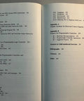 Open book showing contents page of 'Programmable Controllers And Designing Sequential Logic A Practical No Nonsense Guide For Industrial Controls Microprocessor Interfaces And Real World Control Projects' highlighting chapters and topics.