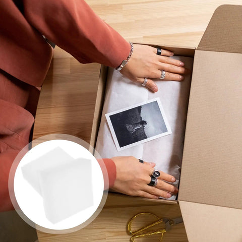 Person placing Rock Solid White Eva Foam Board Two Piece Flexible Packing Inserts With Grid Cutouts in a cardboard box.