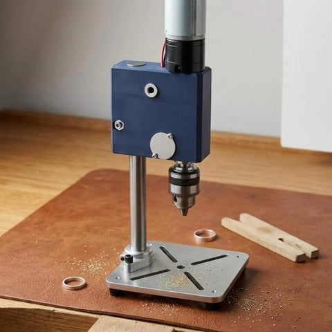 Leefasy Miniature Desktop Drill Press Compact Workbench Tool Precision Boring Machine on wooden surface with metal shavings.