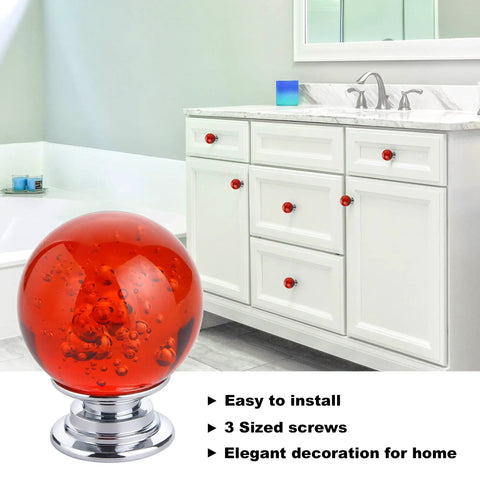 Ten Pack Of Slick Red Crystal Glass Bubble Cabinet Knobs Round Drawer Pulls And Dresser Handles For Kitchen Cupboards With Zero Hassle Mounting Hardware 30 mm Size in bathroom with red crystal knobs on white cabinets.