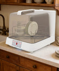 Slick Portable Countertop Dishwasher With Massive 8 Liter Tank And Three Wash Settings Featuring Full 360 Spin Sprayers on kitchen countertop with dishes.