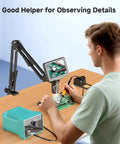 Man using 5 Inch LCD Digital Soldering Microscope With Flexible Stand, 1000X Magnification, for electronics repair.