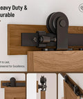 Heavy Duty 10Foot Sliding Barn Door Hardware Kit Featuring Buttery Smooth Silent Rolling Nylon Track System With Knockout 330 Pound Load Capacity For Quick DIY Home Makeovers In Matte Black close-up of durable steel rollers on wood track.