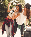Two people traveling with suitcases, enjoying nature and adventure outdoors, representing a sense of freedom and exploration.