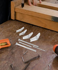Heavy Duty Drywall Anchors And Toggle Bolts Kit, 32 Pcs Metal Wall Fasteners with wing nuts on a workbench