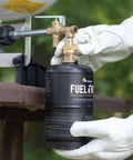 Person using One Pound Propane Refill Kit For Refillable Tank No Fuss Fast Sixty Second Refill With Stabilizing Feet