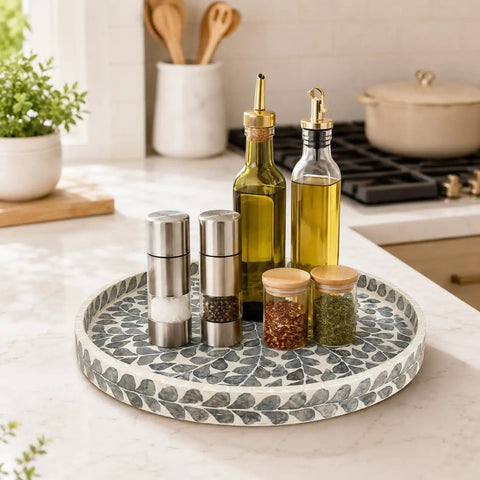 Game Changing 12.5 Inch Wooden Lazy Susan Turntable With A Smooth Swivel Base Sharp Black Leaf Design And Authentic Mother Of Pearl Inlay showcasing spices and oils.