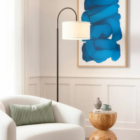 Nora Arc LED Tall Floor Lamp With Heavy Base For Living Room And Office, Sleek Mid Century Modern Black Standing Lamp beside chair