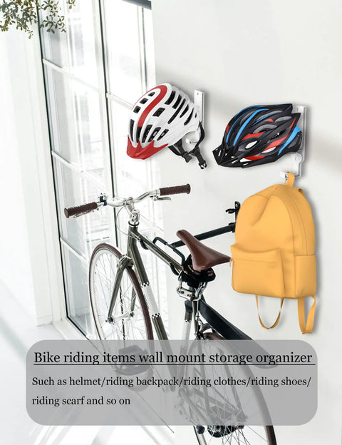 Heavy Duty Universal Helmet Wall Mount 2 Pack White Bike Gear Rack Secure Storage For Motorcycle Tactical Hockey And Ski Helmets Zero Mess Setup Built Tough As Nails with two helmets and a yellow backpack mounted.