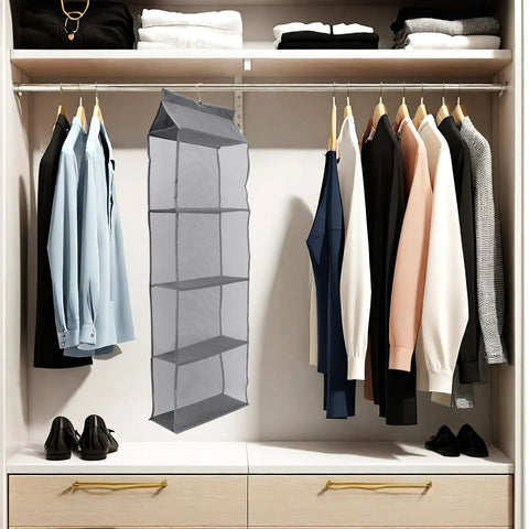 Rock Solid Four Layer Closet Hanging Shelf With Sturdy Hook Nonwoven Mesh Bag Organizer Space Saver Massive Storage For Clothes Snacks And Gear Easy Hang Breathable Fabric Rack in closet with shirts and shoes.