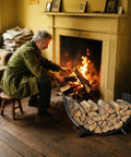 Go-To Rustproof Metal Firewood Rack For Outdoor Fire Pit And Indoor Fireplace Storage in front of fireplace